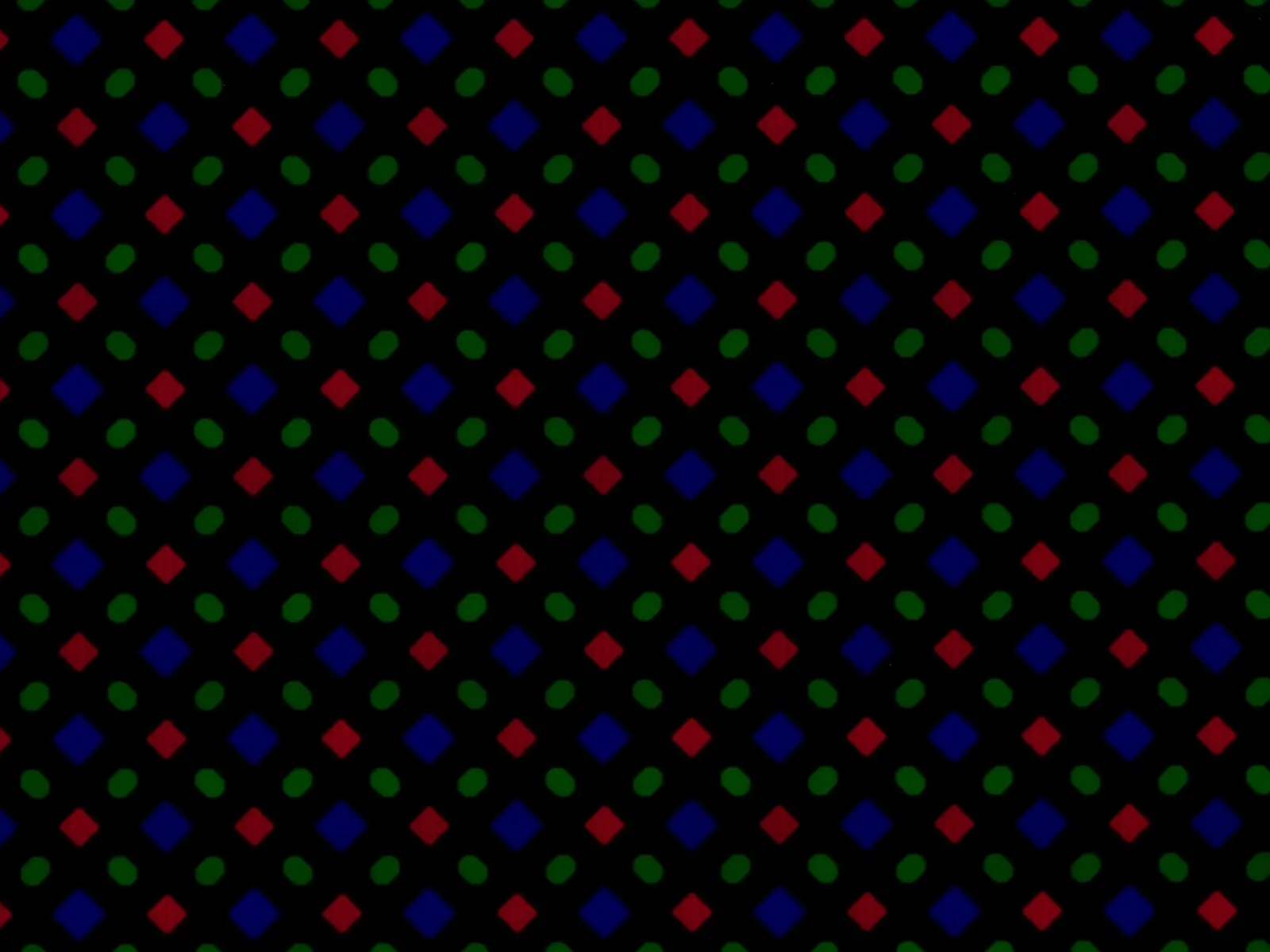 Extreme macro shot of an OLED panel at the pixel level with RGB subpixel grid visible