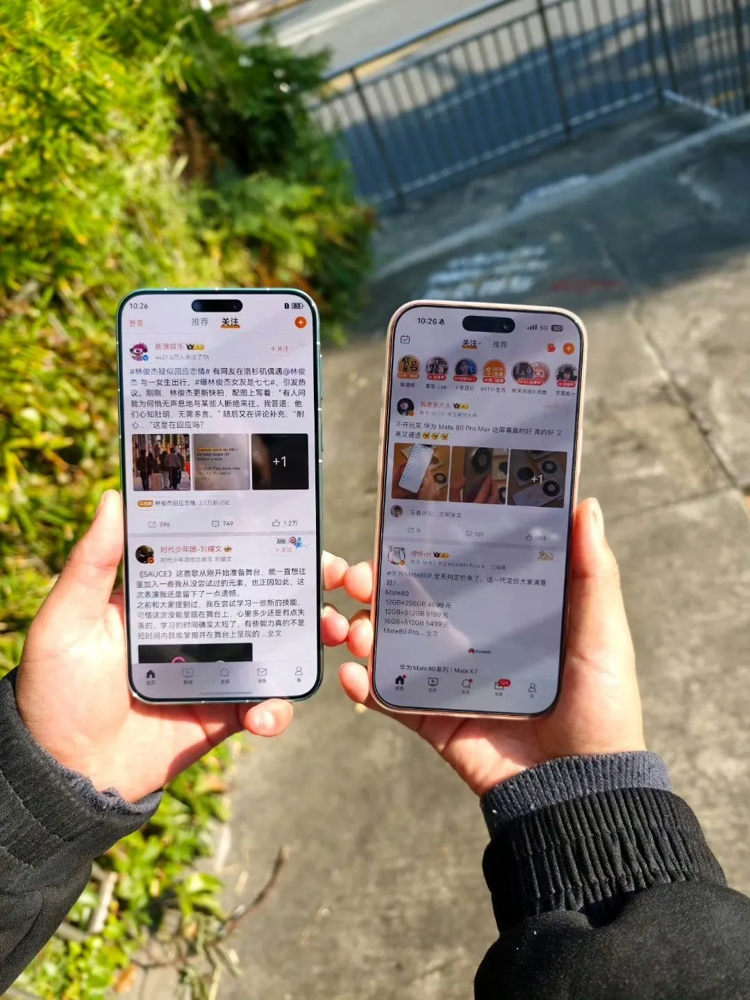Two high-end flagship smartphones (Mate 80 Pro Max and iPhone 17 Pro) side by side showing glowing displays