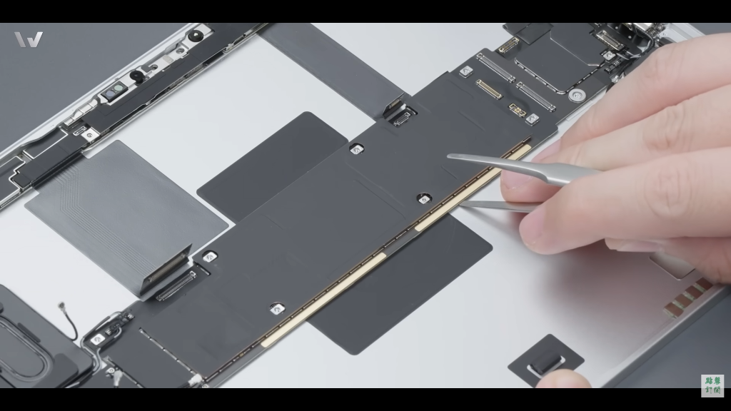 iPad Pro M4 internal teardown showing the central motherboard and M4 chip