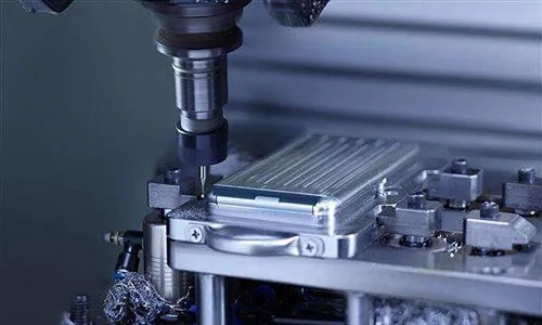 High speed CNC milling machine drilling out an aluminum smartphone chassis