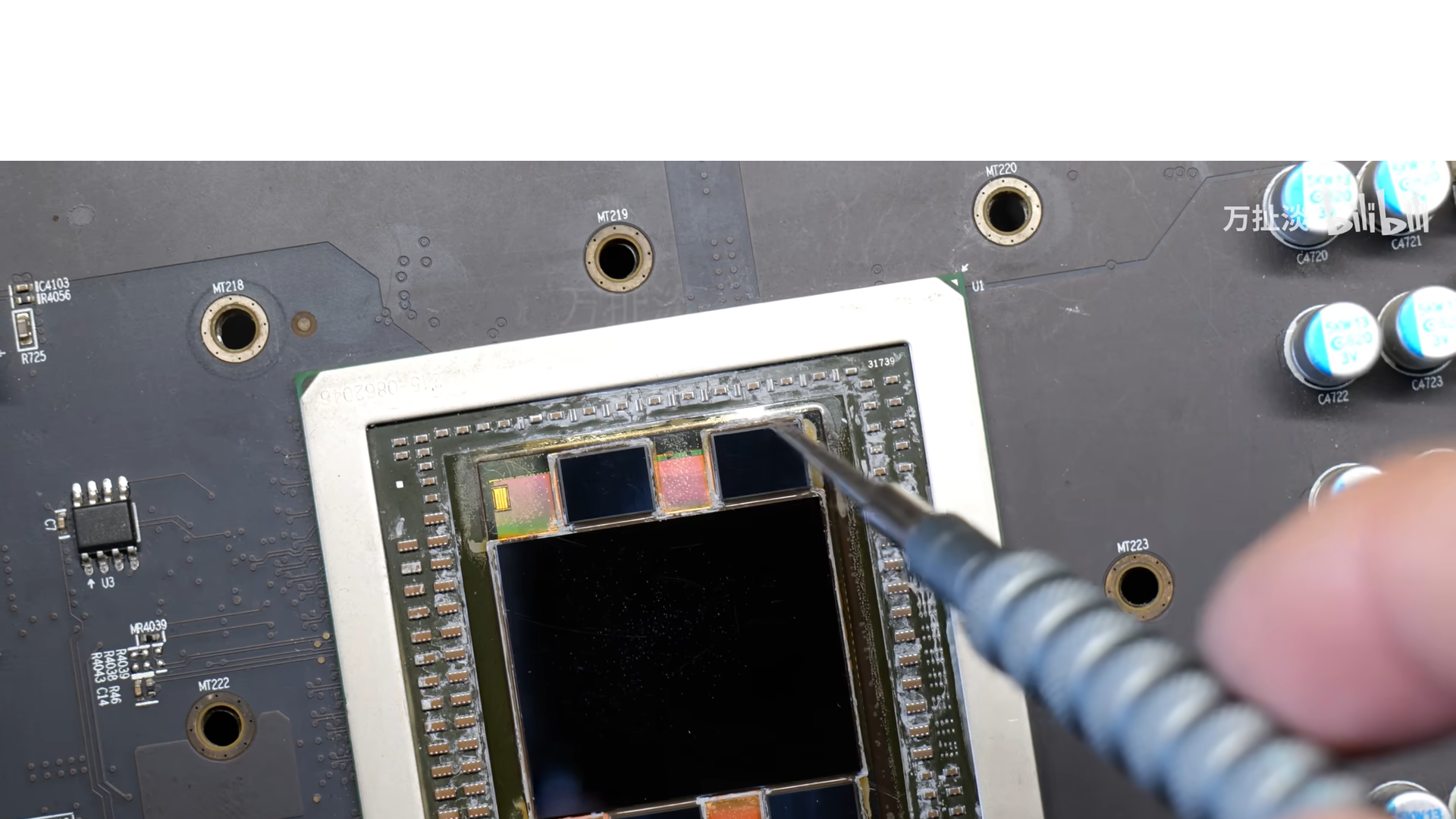 A delidded AMD Radeon R9 Fury GPU showing the central die and 4 surrounding HBM stacks
